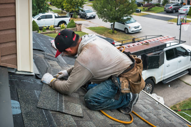 Professional Roofing technician working in Christchurch, VA